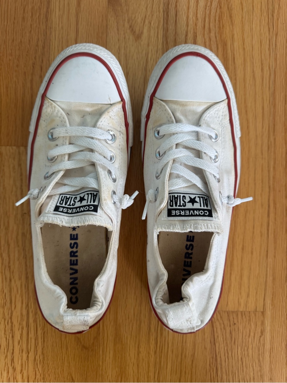 Converse Low Top Canvas Sneakers in White with Red Trim